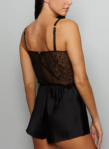 Adorn yourself in evening opulence and bask in elegant relaxation with our marvelous and sumptuous pleasure romper. The elastic waistband and luxuriantly-detailed sheer lace panels gracefully reveal your silhouette and redefine sensuous comfort.