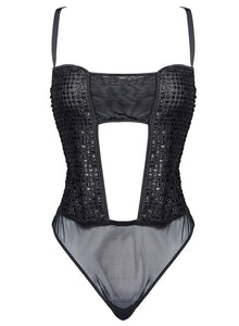 A celebration of fierce femininity, the Melanie embroidered thong playsuit is versatile and electrifying. Its silhouette is expertly crafted to emphasize alluring curves with an ouvert center front opening, high leg, and tonal Italian bindings. The back features an adjustable hook and eye fastener, convertible straps, and a thong shape with a snap closure.