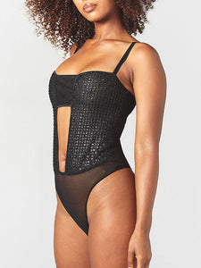 Melanie embroidered thong playsuit is versatile and electrifying. Its silhouette is expertly crafted to emphasize alluring curves with an ouvert center front opening, high leg, and tonal Italian bindings. The back features an adjustable hook and eye fastener, convertible straps, and a thong shape with a snap closure.
