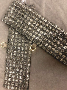 Suzette Cuff Restraints.       Feel the sensuous silk embracing your wrists, topped with shimmering embroidered dots. A detachable golden chain gives you the freedom to tease and tantalize, either in the bedroom or out on the town. Keep your kinks tucked away for when the mood strikes, ignite your wild side and bask in the thrill of the experience!