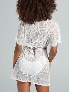 Romantic bed jacket made from lace and silk charmeuse, featuring flirty flutter sleeves and a silk sash that cinches the waist for a timeless, seductive look.