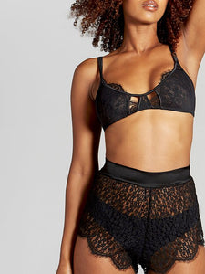 Clio flaunts a luscious inner layer of scalloped lace with delicate eyelashes that temptingly reveals a glimpse of your breasts. Subtle mesh and delicate peep-hole window panels adorn the captivating silhouette of this sheer lace bralette.